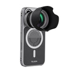 The magnetic lens adapter with hood, mounted to the silver phone case