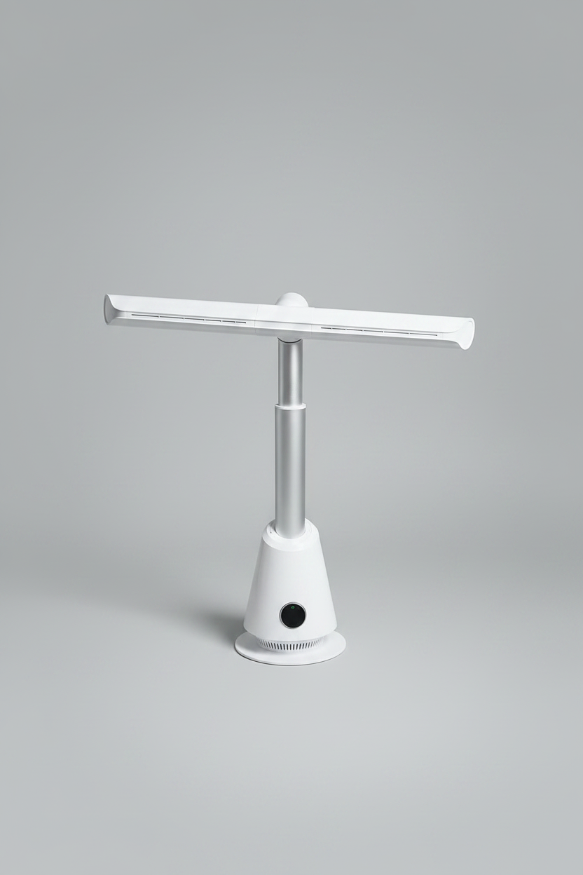 White and silver bladeless tower fan with a wide horizontal air-outlet arm, in a minimal room with a light wood desk