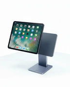 Tablet held by a hand on a stand with text about strong adsorption and stable screen