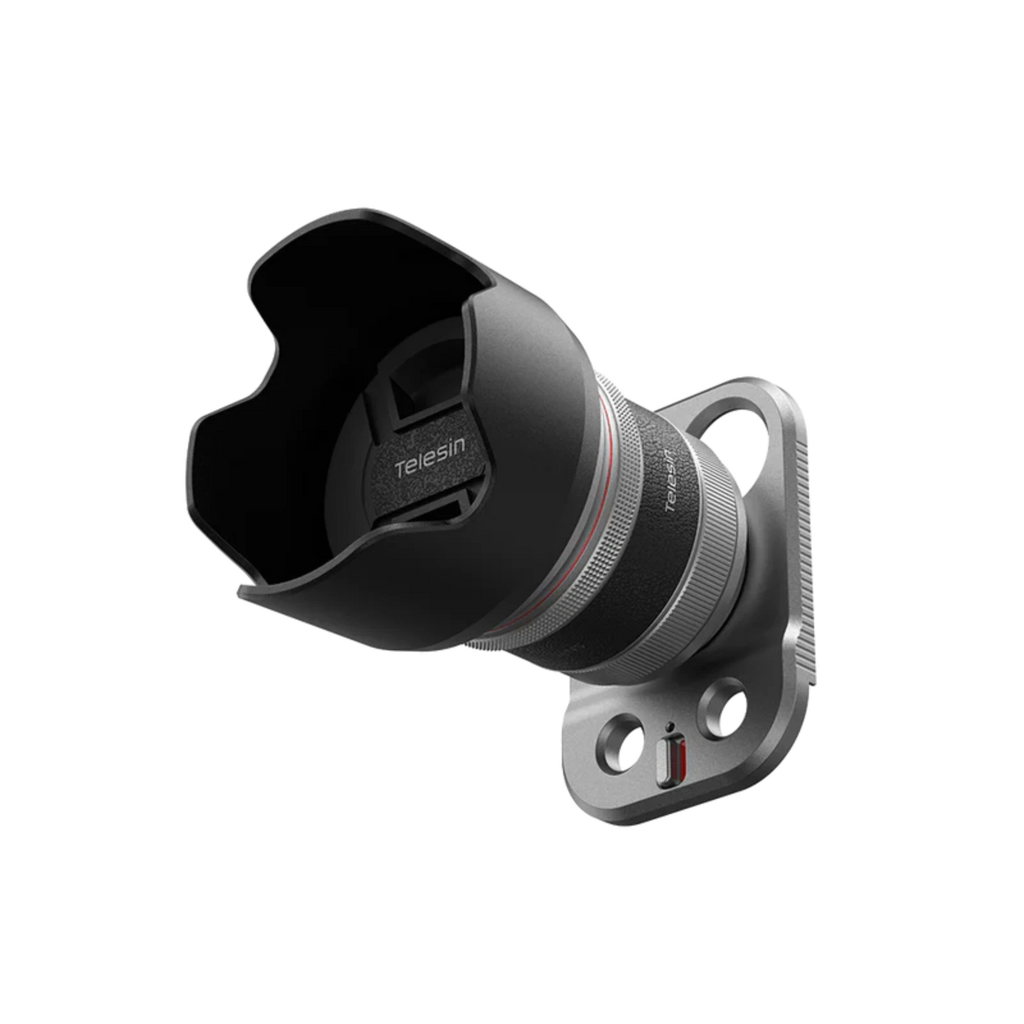 The lens adapter with its black hood and silver metal mount