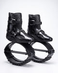 All black kangaroo bounce jump shoes, spring loaded fitness boots, studio side view