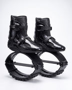 All black kangaroo bounce jump shoes, spring loaded fitness boots, studio side view