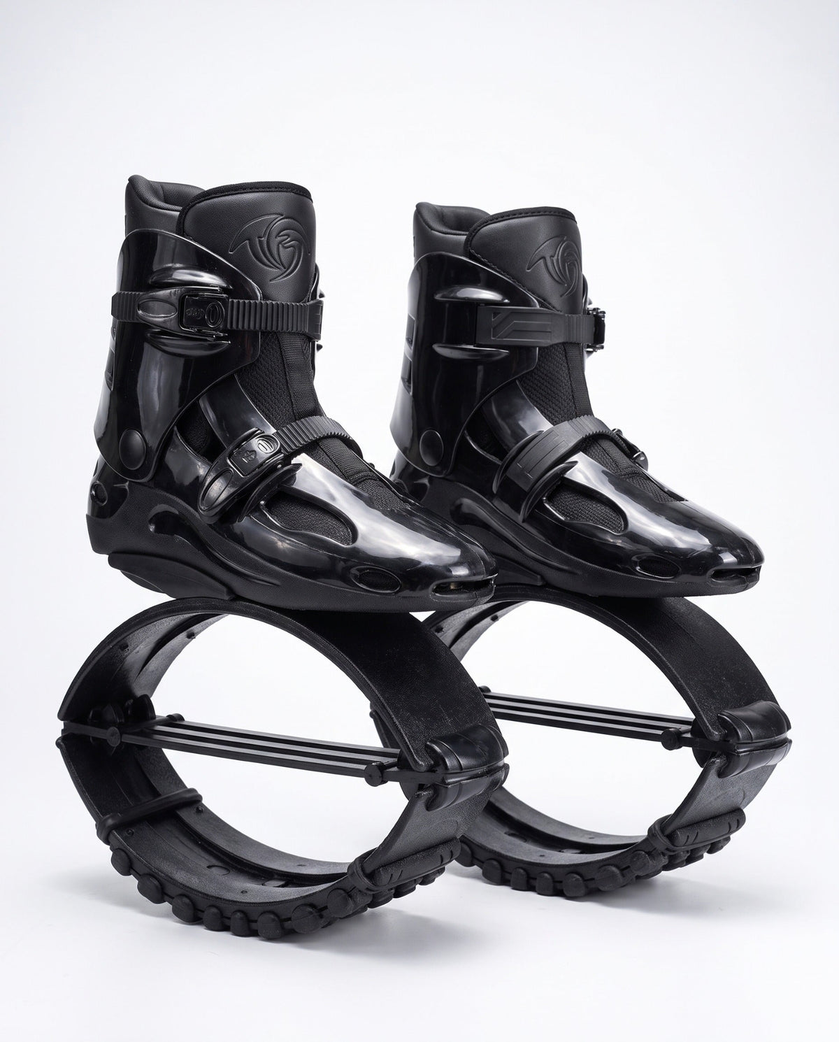 All black kangaroo bounce jump shoes, spring loaded fitness boots, studio side view