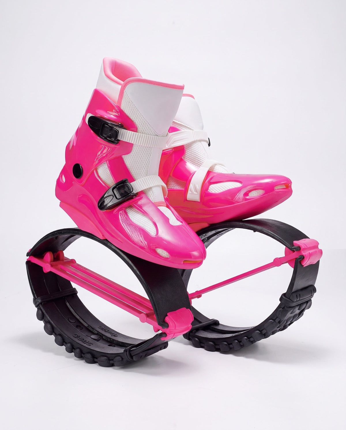 Hot pink and white kangaroo bounce jump shoes, spring loaded fitness boots, studio side view