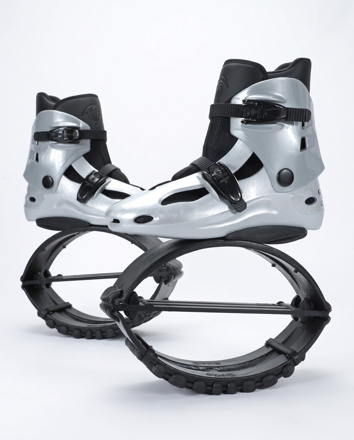Silver and black kangaroo bounce jump shoes, spring loaded fitness boots, studio side view