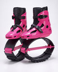 Hot pink and black kangaroo bounce jump shoes, spring loaded fitness boots, studio side view
