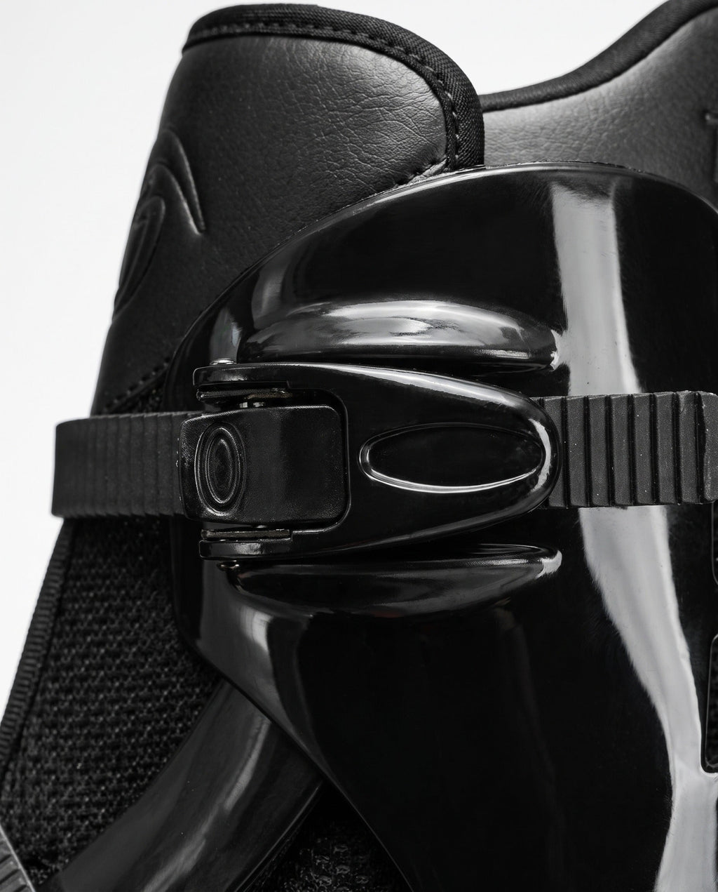 Close up of the multi point cam buckle closure on a black bounce jump shoe