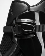 Close up of the multi point cam buckle closure on a black bounce jump shoe