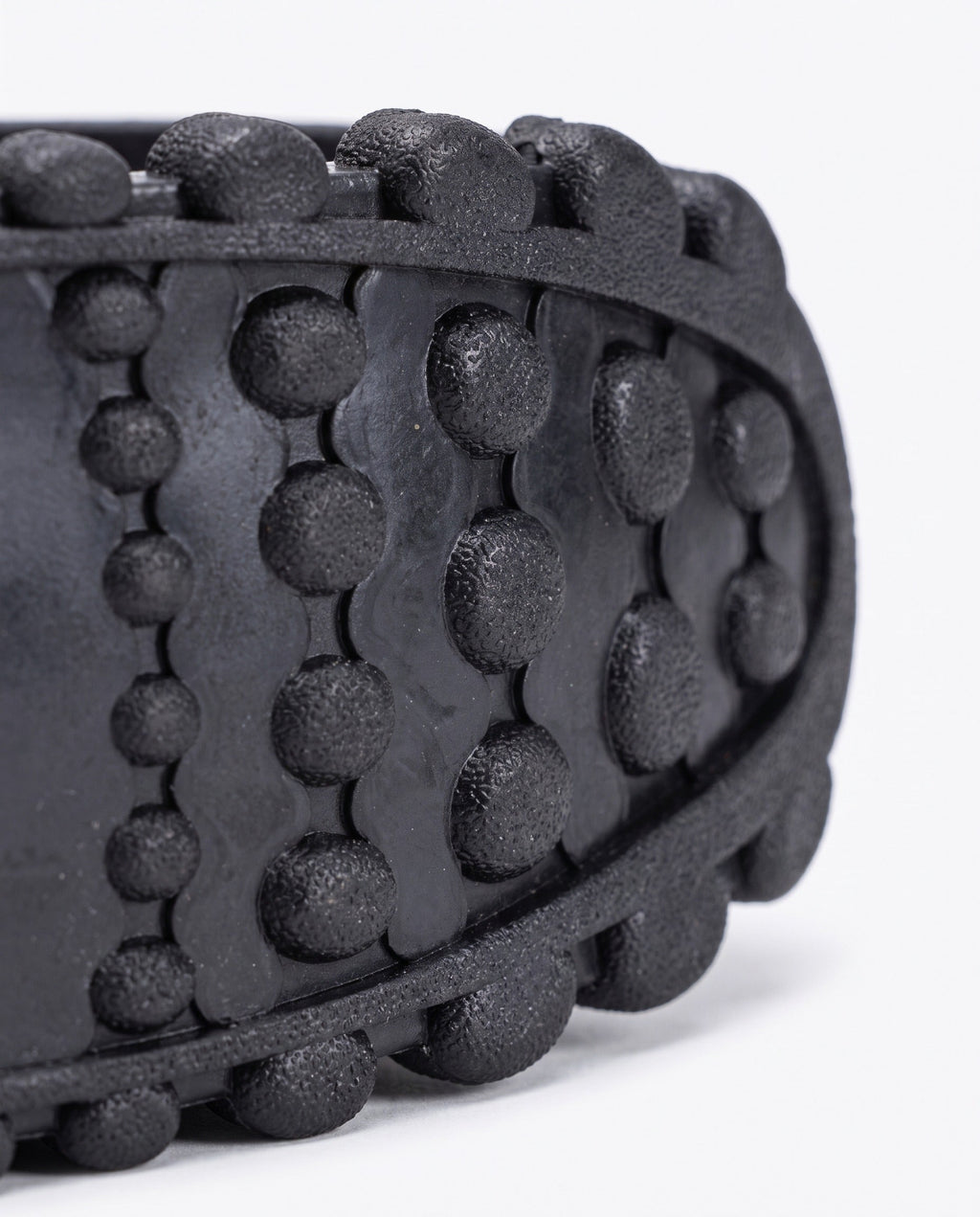 Close up of the knobbled rubber tread on the bounce jump shoe spring frame