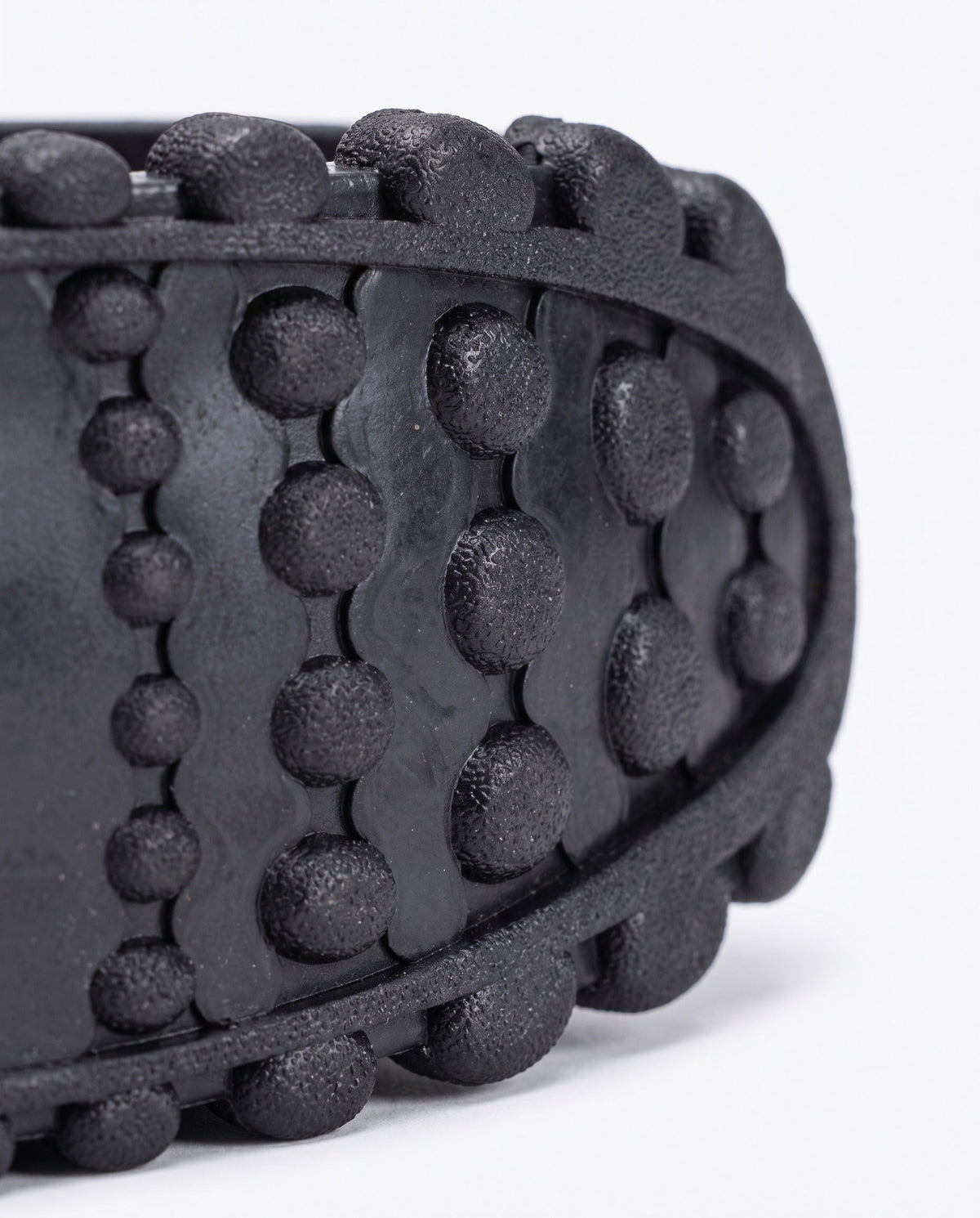 Close up of the knobbled rubber tread on the bounce jump shoe spring frame