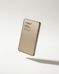 The 5000 mAh power bank in champagne gold, shown floating at an angle