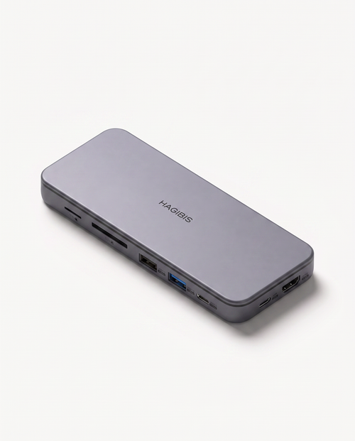A silver-gray MagBoost portable power bank with multiple ports on the side, shown at an angle on a clean white background.