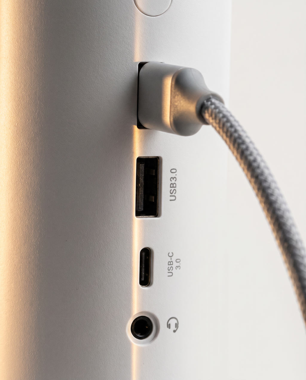 Close view of the docking station's side ports, including USB 3.0 with a braided cable connected