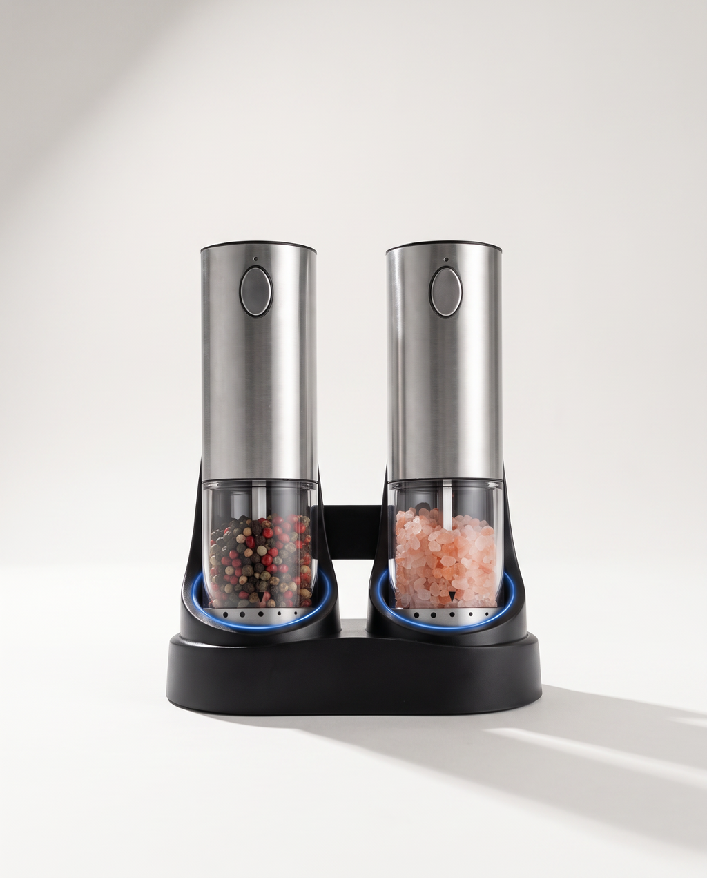 Electric salt and pepper grinder set, two stainless steel mills on a shared black base