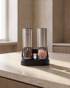 The grinder set standing on a light stone kitchen worktop