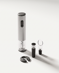 Four-piece electric wine opener gift set in light grey — corkscrew, foil cutter, vacuum stopper and aerator pourer on a soft white studio background