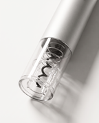Macro detail of the clear bottle-neck receiver, showing the carbon steel spiral screw through the transparent lower section
