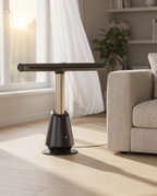 The bladeless tower fan on a pale oak floor beside a linen sofa on a summer afternoon