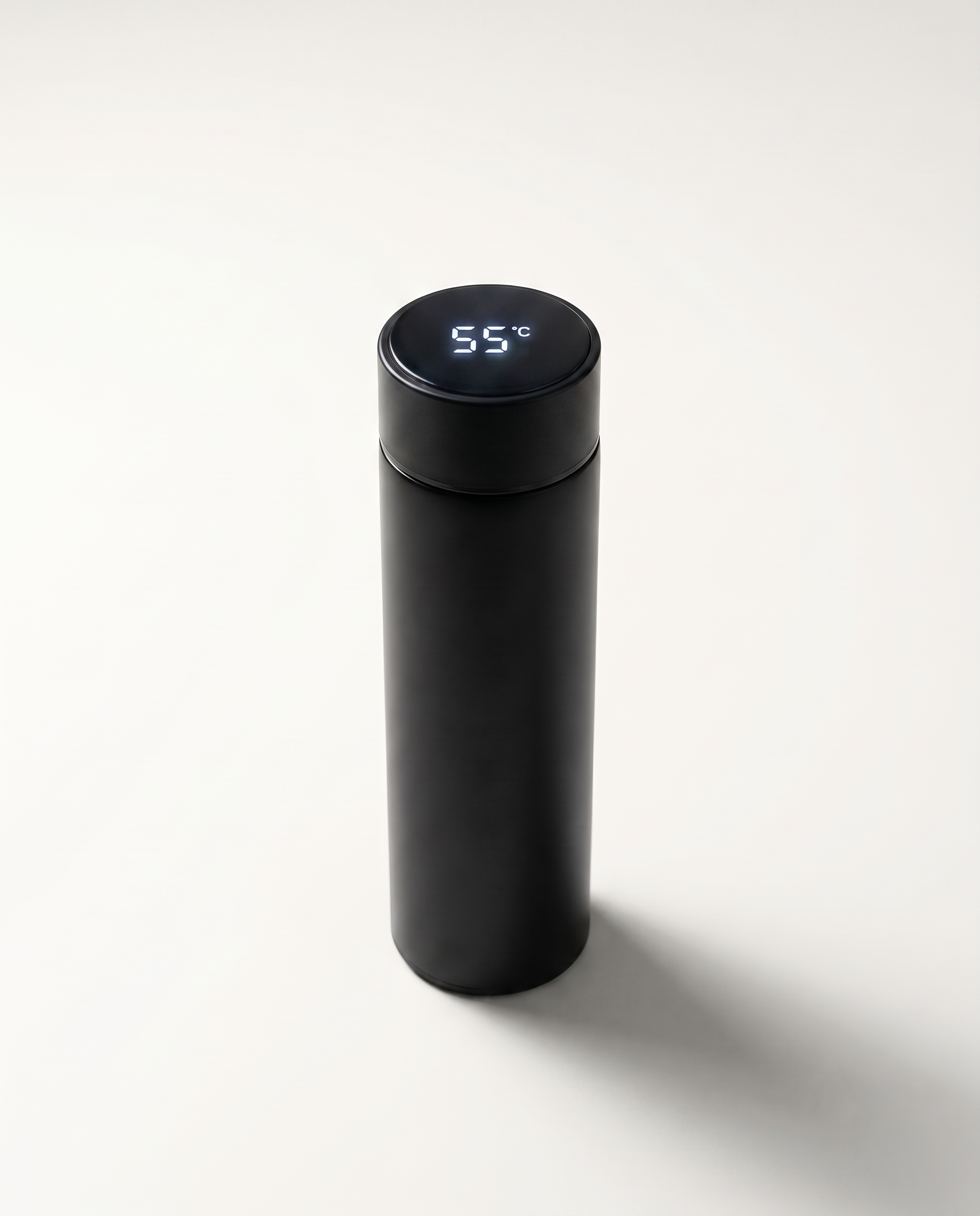 LED thermos cup in black, lid display lit and reading 55°C, on a soft white studio background