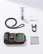 The full kit laid out: underwater housing, vacuum pump, safety hand strap, USB charging cable, cleaning cloth and instruction manual.