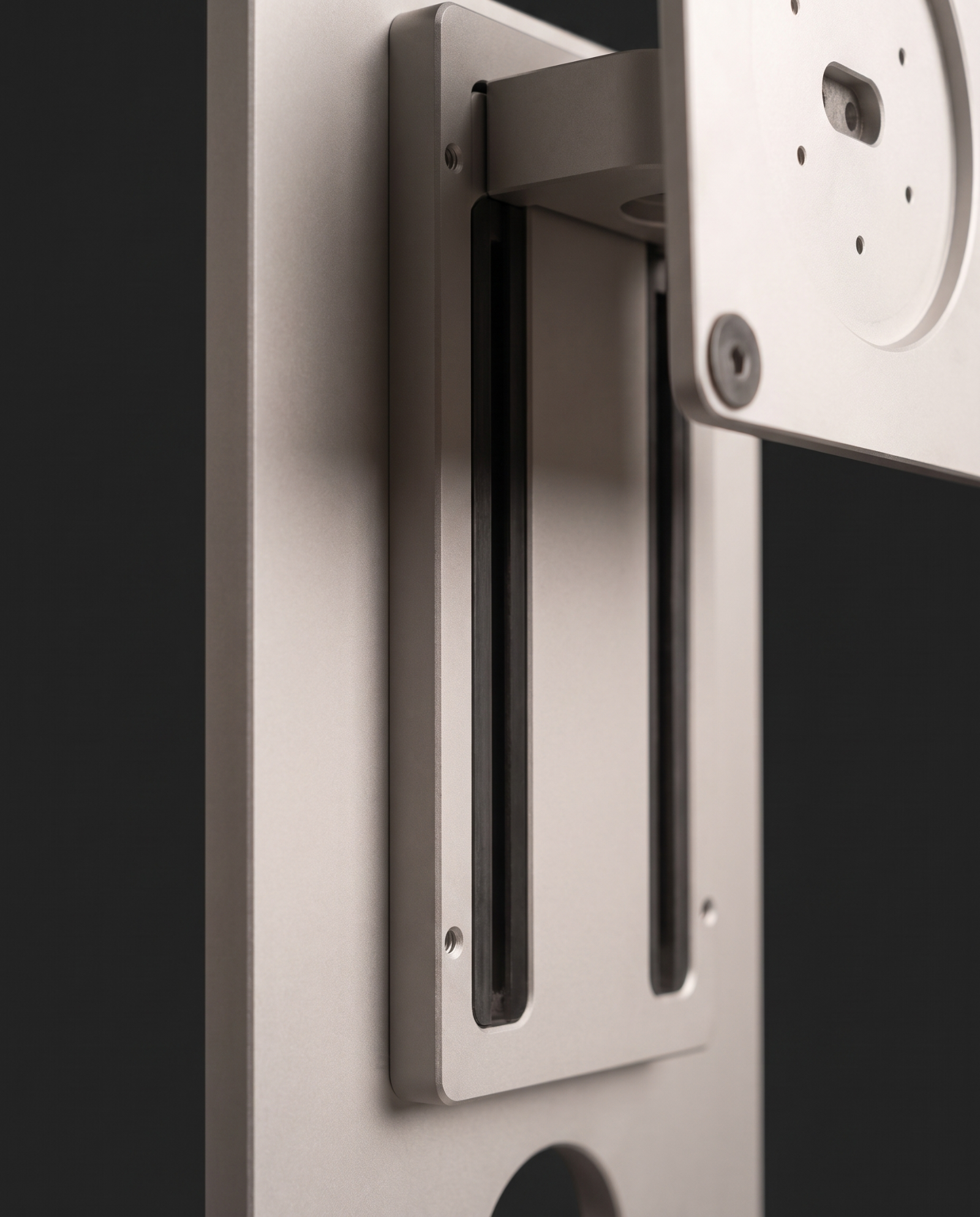 Close view of the lift carriage and its guide rails, showing the travel available for height adjustment.