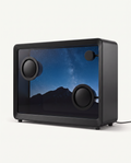 Floating lyrics speaker in matte black with a 21.5 inch transparent screen showing a night sky