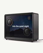 Song lyrics displayed in white across the transparent screen of the floating lyrics speaker