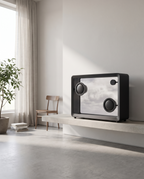Transparent screen speaker on a concrete shelf in a bright minimal studio room