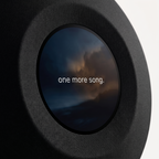Close view of the 29 cm circular display, where the woven speaker cloth meets the glass